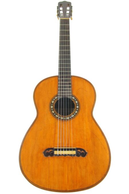 The Miguel Rodriguez 1925 Classical Guitar features a wooden body, six strings, a decorative rosette, and detailed bridge and edges, displayed against a white background.
