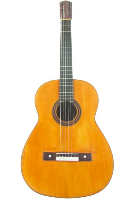 A Domingo Esteso 1922 Classical Guitar, featuring six strings, a natural wood finish, dark fingerboard, and round sound hole, shown from the front on a white background.
