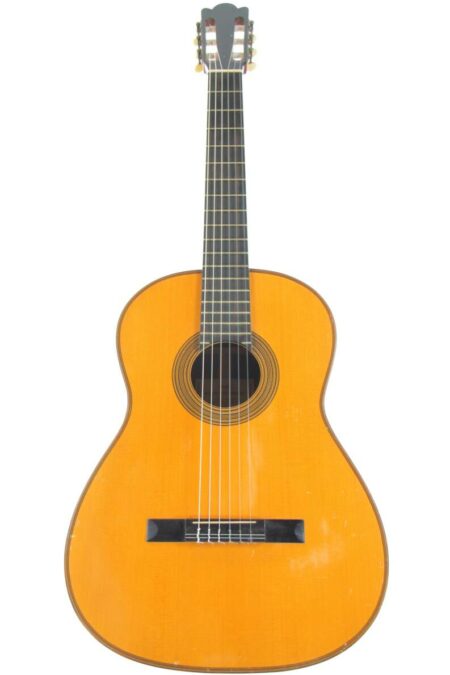 The Dieter Hense 1960 Classical Guitar features a wooden body, six strings, a dark fingerboard, and a circular sound hole, shown against a white background.