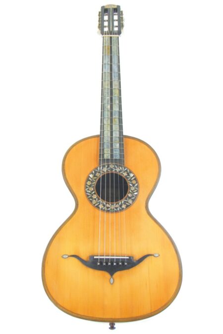 The Leon Victor Mougenot 1900 Romantic Guitar features a light wood body, ornate sound hole rosette, and decorative fretboard inlays, photographed against a white background.