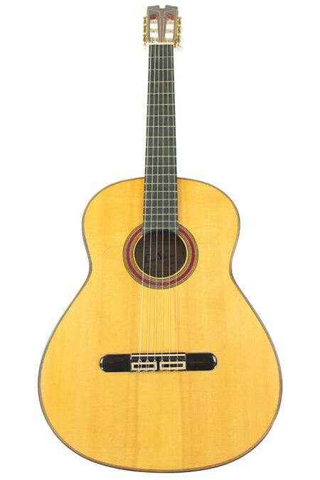 The Luis Sanchez Rodriguez 2020 Flamenco Guitar features a natural wood finish, dark frets, and six nylon strings, shown from above on a white background.