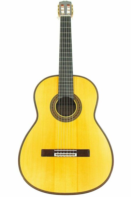 The Stefan Nitschke 2023 Santos Hernandez Classical Guitar features a light wood body, dark fretboard, six strings, and a decorative rosette around the sound hole, presented against a white background.