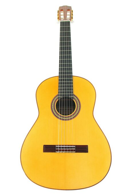 The Alberto Hernandez - Marcelo Barbero Flamenco Guitar features a light wood body, dark fingerboard, and six strings, shown against a white background.