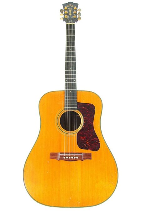 A full view of the Guild D-44 1967 Acoustic Guitar with a natural wood finish, black fretboard, and dark pickguard, displayed on a white background.