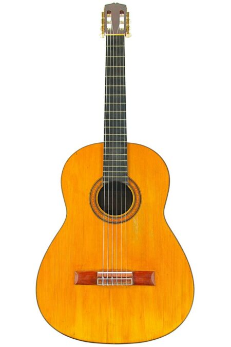 A Manuel de la Chica 1968 Classical Guitar with a wooden body, six strings, and a dark fretboard is shown against a white background.