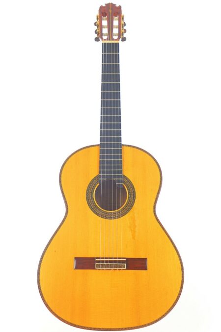 A Manuel Contreras 10th Anniversary 2007 Classical Guitar is shown with a natural wood finish and dark fretboard, featuring six strings, photographed against a plain white background.