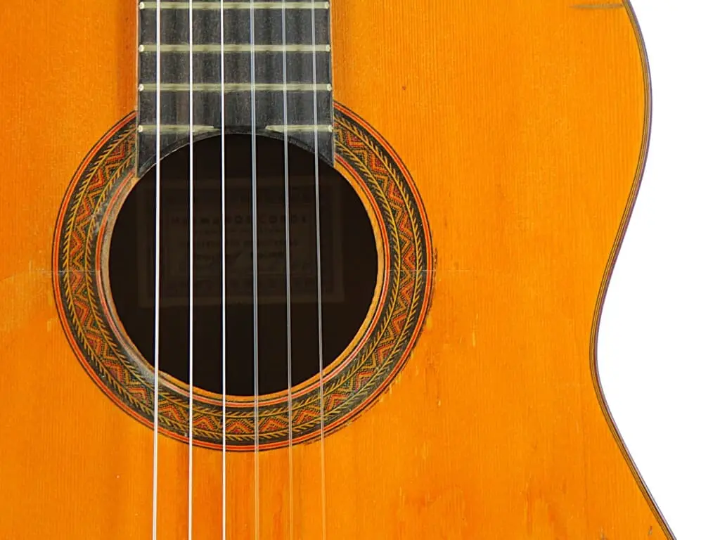 Close-Up Of A Hermanos Conde 1966 Faustino Conde Flamenco Guitar’s Sound Hole And Strings, Highlighting Its Ornate Circular Rosette On The Wooden Body, With The Neck And Frets Partially Visible At The Top.
