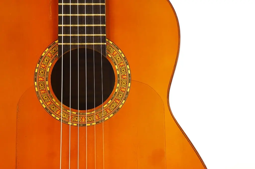 Close-Up Of The Manuel G. Mayoral 1980 Flamenco Guitar, Focusing On Its Body, Strings, And Decorative Rosette Sound Hole, Set Against A White Background.