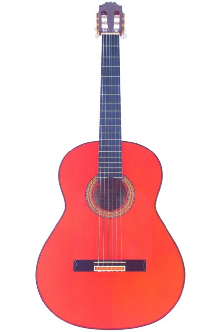 The Hermanos Sanchis Lopez F. Extra 2008 Flamenco Guitar features a bright red body, black fretboard, and six strings, shown against a white background.