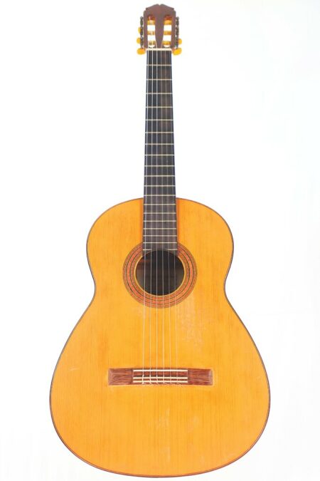 The Marcelino López Nieto 1954 Flamenco Guitar features a light wood body, dark fretboard, and six strings, shown in a photograph against a plain white background.