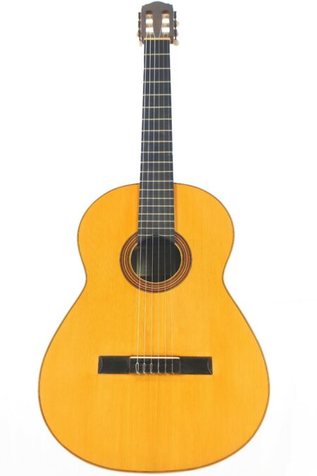 A Hermanos Conde 1970s negra Flamenco Guitar with a natural finish, six nylon strings, a round sound hole, and dark fretboard is shown in full view against a plain white background.