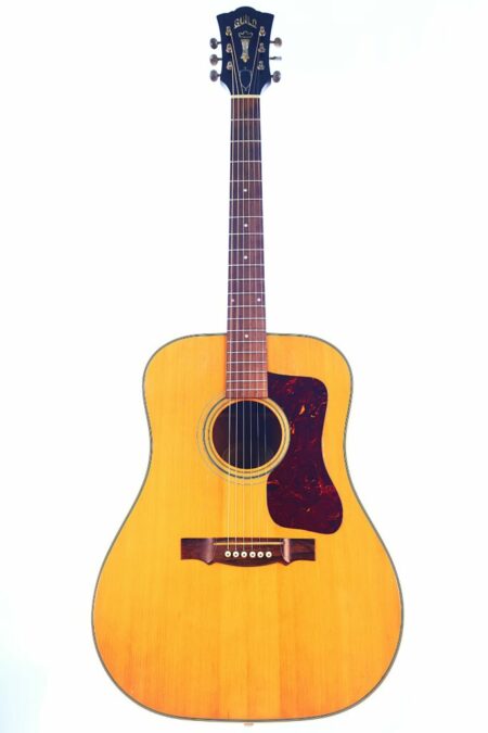 The Guild D-40 1967 Acoustic Guitar features a natural wood finish, six strings, dark pickguard, and black headstock, shown upright against a plain white background.