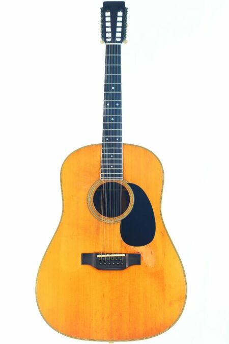 A full view of a Martin D-12-35 1967 12-string acoustic guitar with a natural wood finish, dark pickguard, and white tuning pegs, photographed against a plain white background.