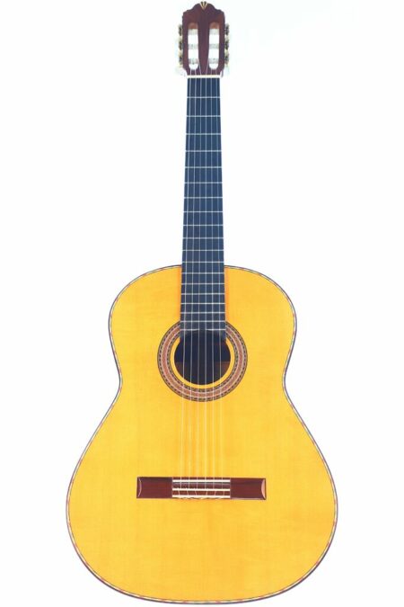 The Andrés Marvi 2021 Negra Flamenco Guitar features a light wood body, dark fretboard, and six strings, shown vertically on a white background.