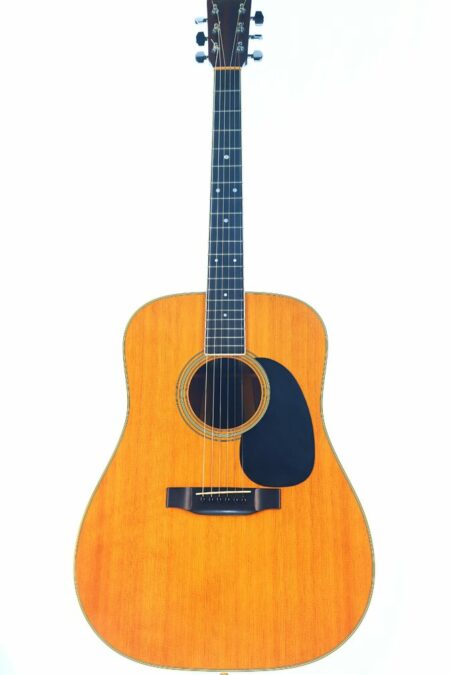 A full view of the Martin D-35 1979 Acoustic Guitar with a natural wood finish, black pickguard, and six strings, isolated on a white background.