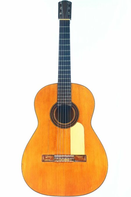 The Santos Hernandez 1916 Classical Guitar features a natural wood finish, dark fingerboard, six strings, and a decorative rosette around the sound hole, shown photographed against a white background.