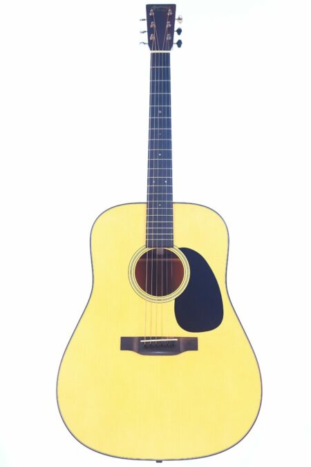 The Martin D-18 2023 Acoustic Guitar features a light-colored wooden body, dark fretboard, and black pickguard, shown against a white background.