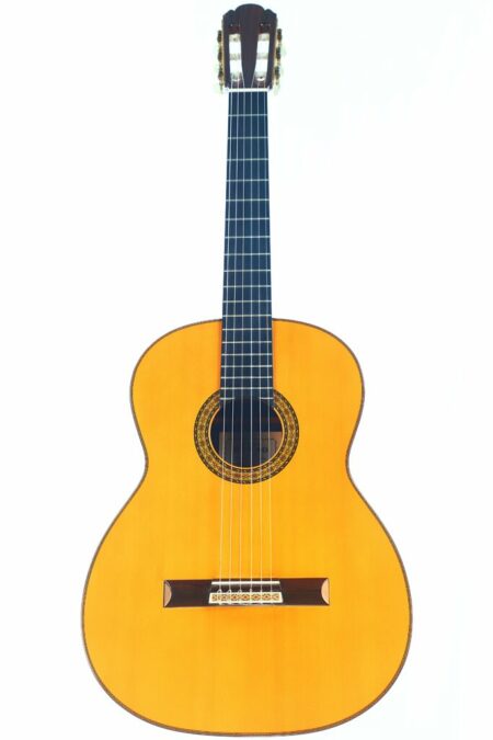 The Masaru Kohno Concert 1982 Classical Guitar features a light wooden body, dark fretboard, and six strings, photographed against a white background.