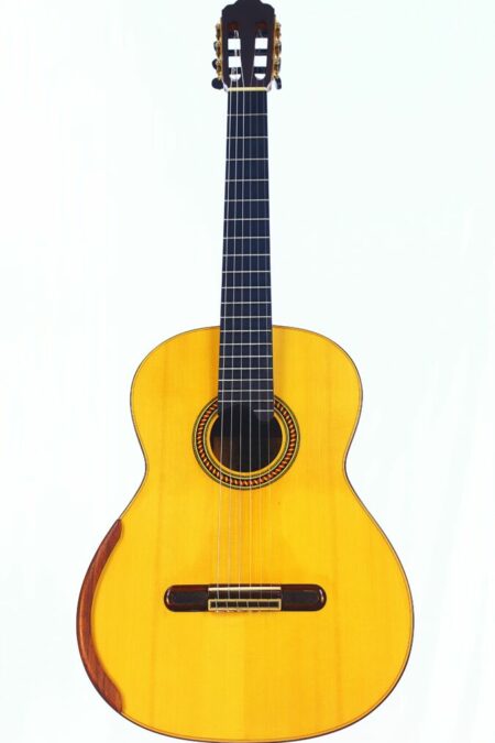 The YuLong Guo 2014 Chamber Concert Classical Guitar features a light wood body, dark fretboard, and ornate rosette, beautifully photographed against a plain white background.