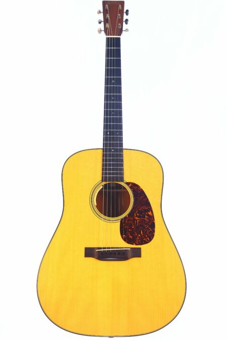 A full-length image of the Martin D-18 1937 GE 2012 Acoustic Guitar, featuring a light wood body, dark pickguard, round sound hole, and dark neck and headstock, shown against a plain white background.