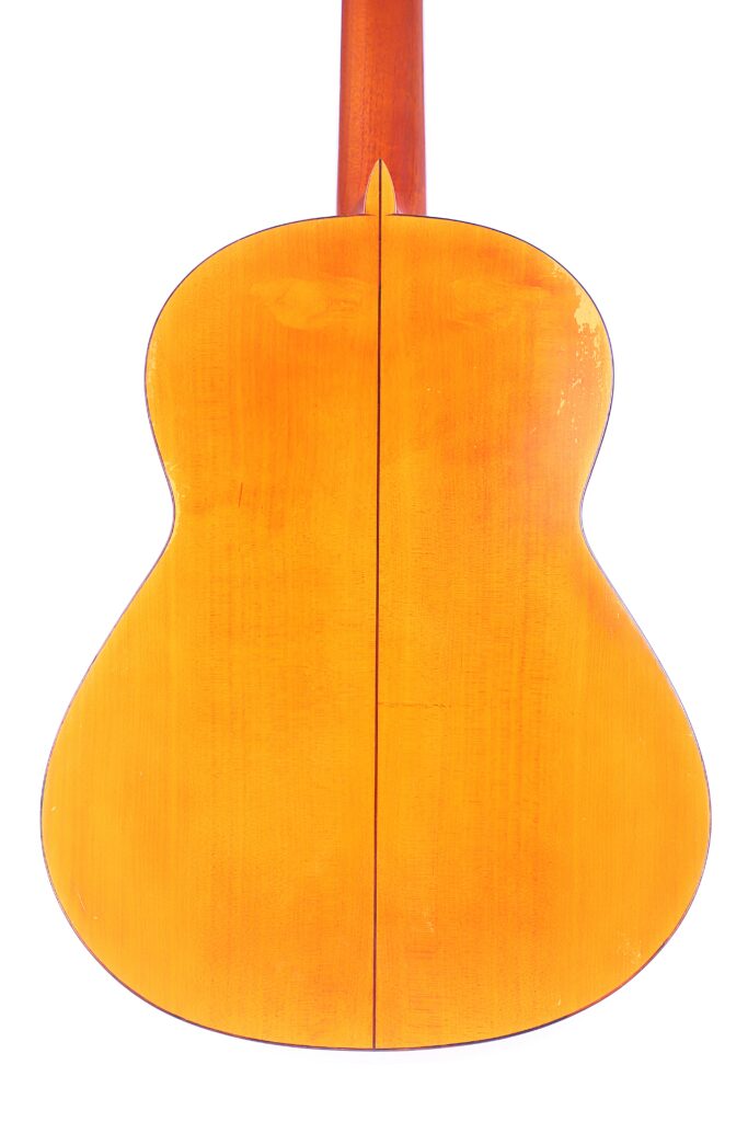 Back View Of The Jose Ramirez 1968 Flamenco Guitar Featuring A Smooth, Light Wood Finish With Visible Grain Patterns, Photographed Against A White Background.