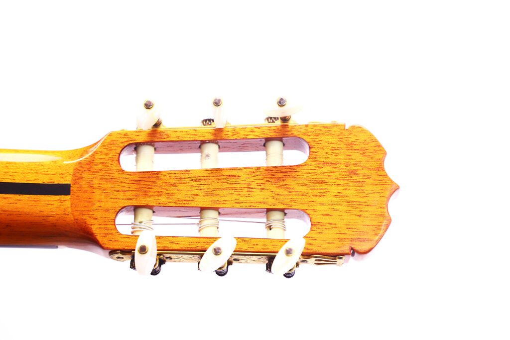Close-Up Of The Headstock Of A Jose Ramirez 1A 1975 Classical Guitar With Six White Tuning Pegs, Shown Against A Plain White Background.