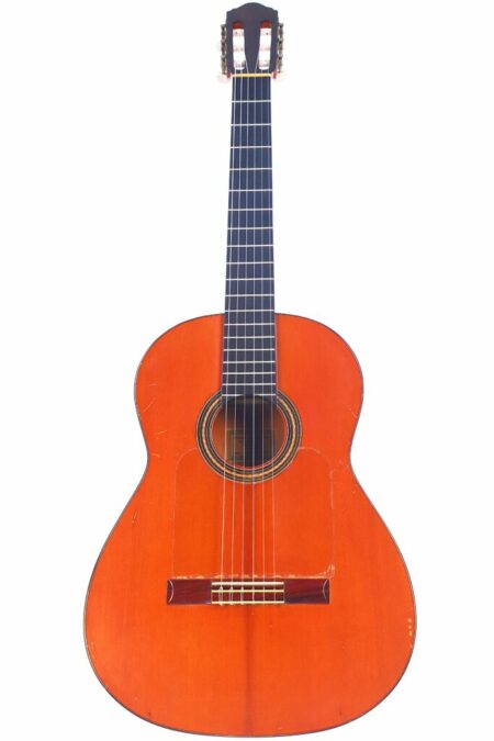 A Conde Hermanos 1978 Flamenco Guitar featuring a wooden body, six strings, and a dark fingerboard, displayed upright against a white background.