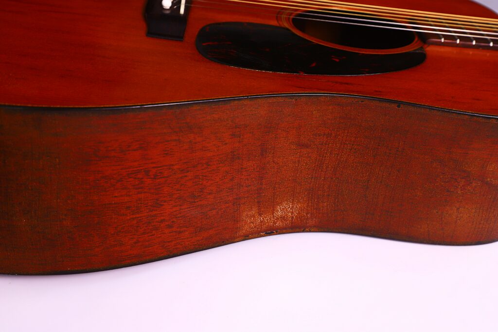 Close-Up Of The Side And Body Of A Martin D-18 1967 Acoustic Guitar, Showing Wood Grain And Strings Against A Plain White Background.