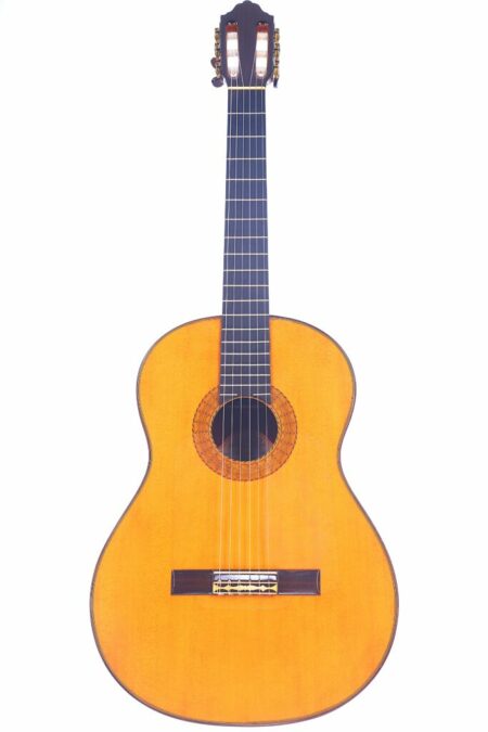 The Juan Montero 1994 Negra Flamenco Guitar features a wooden body, dark fretboard, and six strings, shown on a white background.