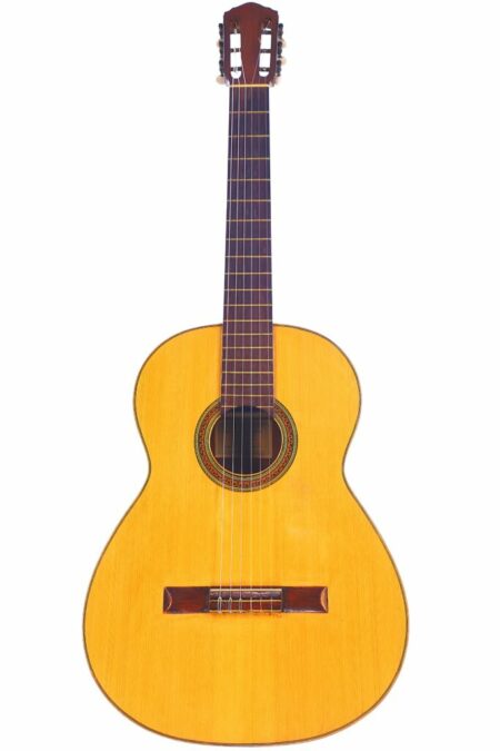 The Conde Hermanos 1970 Negra Flamenco Guitar features a light wood body, dark wooden neck, and six strings, shown against a white background.