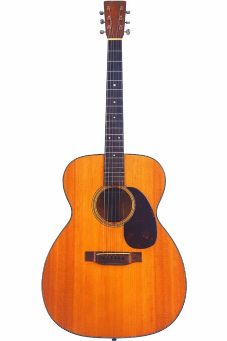The Martin 000-18 1950 Acoustic Guitar features a natural wood finish, dark pickguard, six strings, and metal tuning pegs, displayed against a white background.