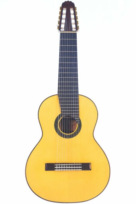 The Amalio Burguet 1a 10-string Classical Guitar features a light-colored wooden body, dark fretboard, and bridge, shown on a white background.