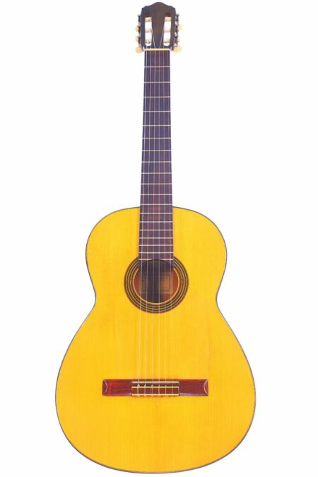 The Conde Hermanos 1971 Flamenco Guitar features a light wooden body, dark fretboard, and six strings, displayed against a white background.