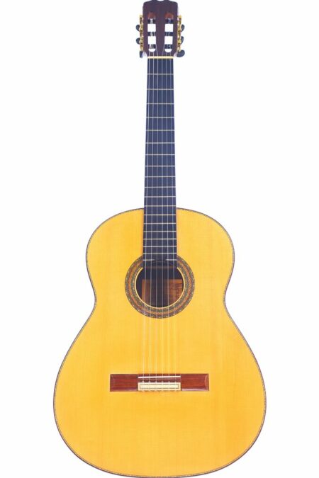 The Felipe Conde 1992 Negra Flamenco Guitar features a light wood body, dark fretboard, and six strings in a classic flamenco style, presented against a white background.