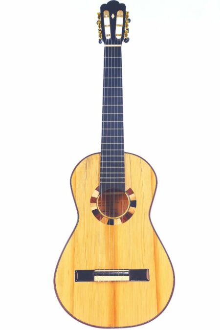 The Siscu Garcia 2024 Torres Romantic Guitar features a light wood body, dark fretboard, six strings, and an ornate circular rosette around the sound hole, displayed on a plain white background.