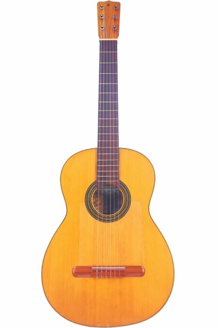The José Ramirez 1927 Classical Guitar features a light brown wooden body, six strings, a decorative rosette around the sound hole, and a dark fretboard, displayed against a white background.