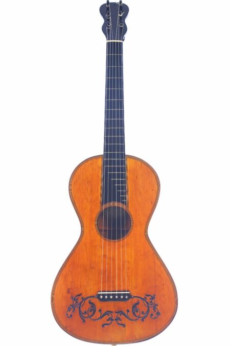 The Johann Georg Stauffer 1810 Romantic Guitar is an antique acoustic guitar featuring a wooden body, six strings, black floral patterns near the bridge, and a dark neck with simple tuning pegs.