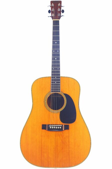 The Martin D-35 1973 Acoustic Guitar features a natural wood finish, black pickguard, white dot fretboard inlays, and six tuning pegs, shown against a white background.