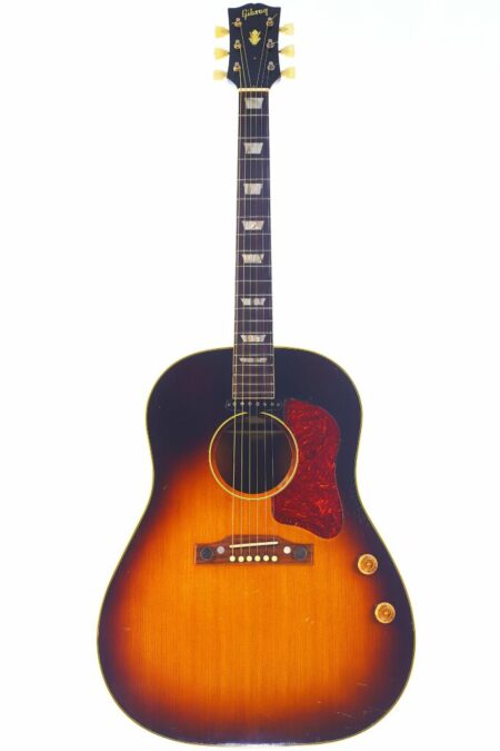The Gibson J-160E 1955 Acoustic Guitar features a sunburst finish, pearl fretboard inlays, a red pickguard, and two control knobs on the body, shown on a white background.