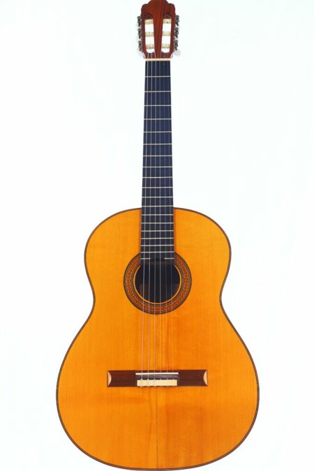 The Josip Krog 1979 Classical Guitar features a wooden body, six strings, a dark fingerboard, and a decorative sound hole, displayed against a plain white background.