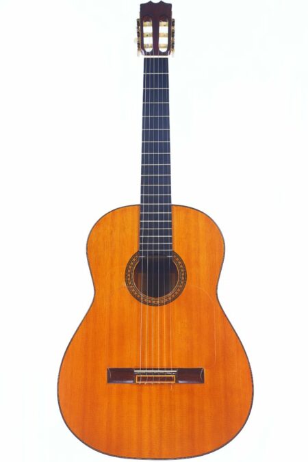 The Hermanos Conde 1975 Faustino Conde Flamenco Guitar, a classic acoustic design with a wooden body, dark fretboard, and six strings, is shown in a photo against a plain white background.