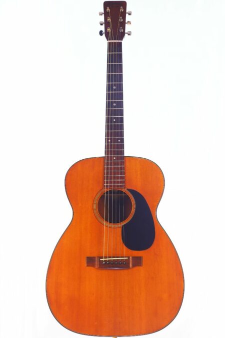 The Martin 00-18 1966 Acoustic Guitar features a natural wood finish, six strings, a dark pickguard, and dot inlays on the fretboard, displayed against a plain white background.