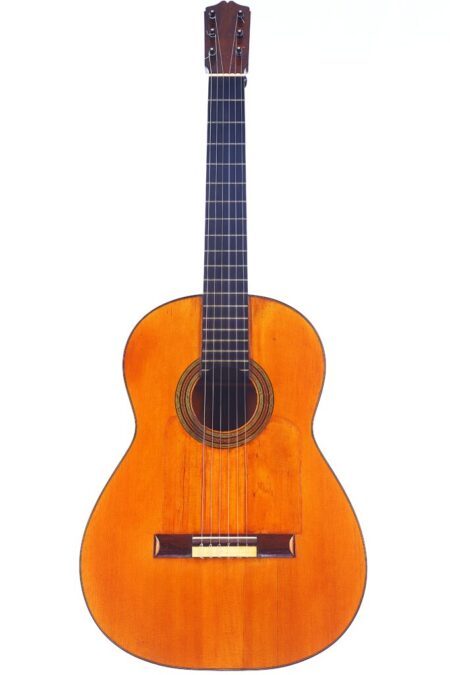 A Santos Hernandez 1930 Flamenco Guitar with six strings and a dark fretboard is shown against a white background.