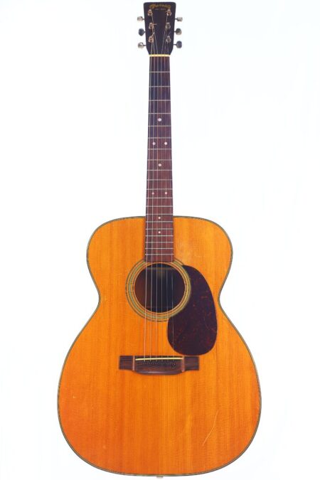 The Martin 000-21 1947 Acoustic Guitar features a natural wood finish, dark fretboard, round soundhole, and dark pickguard, shown against a plain white background.