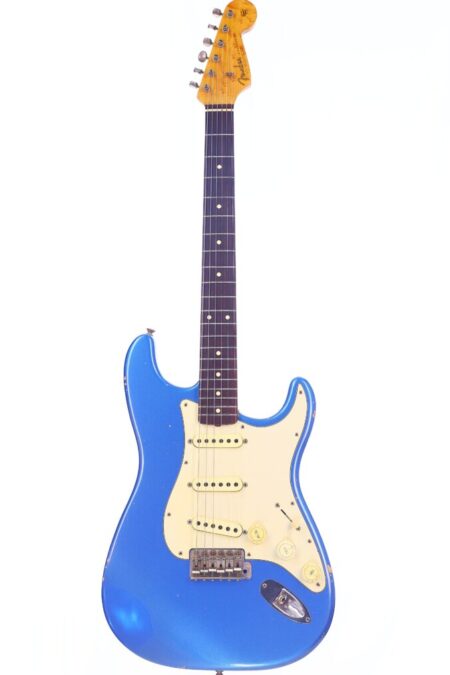 A Fender Stratocaster 1960 Relic Cunetto/Cruz Electric Guitar in blue with a white pickguard, three control knobs, and a maple neck and headstock, photographed against a white background.