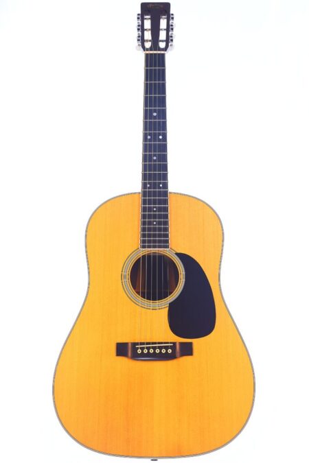 A Martin D-35S 1988 acoustic guitar with a natural wood finish, black pickguard, six strings, and a dark fretboard is shown in full view against a white background.