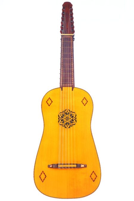 The Andres Martin 1980 Vihuela features a light wooden body, an intricate rosette sound hole, ten strings, and decorative diamond-shaped inlays, shown in a photo against a white background.