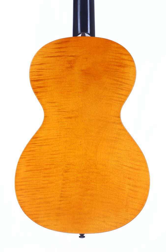 The Back Of A Bernhard Kresse 2011 Stauffer Romantic Guitar Features Smooth, Glossy Light Brown Wood With Subtle Grain Patterns. The Image Is Set Against A White Background, Showing Only The Guitar Body And Part Of The Neck.