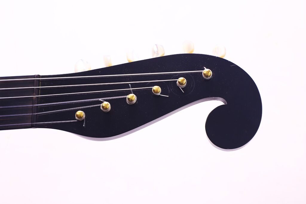 Close-Up Of A Bernhard Kresse 2011 Stauffer Romantic Guitar Headstock With Gold Tuning Pegs And Six Strings, Photographed On A White Background.