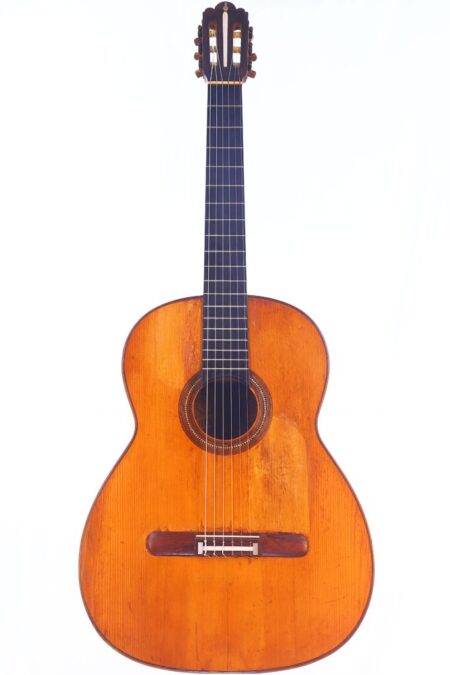 The Salvador Ibanez 1900 Classical Guitar Features A Wooden Body, Six Strings, And A Dark Fretboard, Displayed Upright Against A Plain White Background.